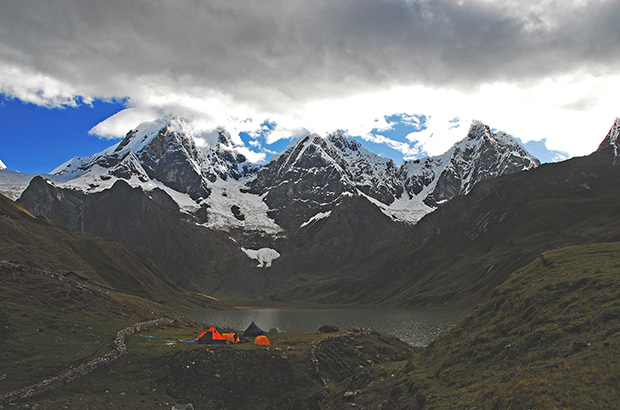 Base camp at the foot of the 'Three Sisters of Huayhuash' - Siula Grande, Yerupaja and Yerupaja Chica