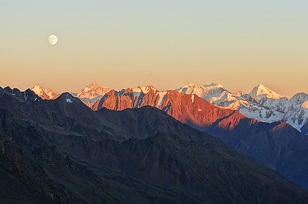Sunset over the Main Caucasus Range, view from the Irik Chat pass on the ascent route to Mount Elbrus Sleeping mat.
