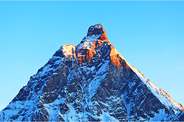 The top of the Matterhorn catches the first rays of the rising sun